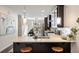 Modern kitchen features stainless steel appliances, a breakfast bar, and pendant lighting at 754 Aerial Way, Atlanta, GA 30312
