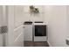 Neat laundry room with a washer and dryer, and a shelf for storage at 754 Aerial Way, Atlanta, GA 30312