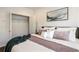 Neutral bedroom with hardwood floors, closet, and a large comfortable bed at 754 Aerial Way, Atlanta, GA 30312