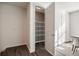 Bright pantry featuring wire shelving, a white door, and wood-look flooring at 754 Aerial Way, Atlanta, GA 30312
