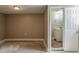 Basement with utility access and adjacent bathroom with bright vanity at 810 N Carter Dr, Jonesboro, GA 30236