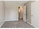 Neutral bedroom features plush carpet, fresh paint, and ample natural light at 810 N Carter Dr, Jonesboro, GA 30236