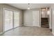 Open dining area showcasing tile floors, sliding glass doors to the deck, and a staircase at 810 N Carter Dr, Jonesboro, GA 30236