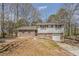 Traditional two-story home featuring a brick and siding exterior with an attached garage at 810 N Carter Dr, Jonesboro, GA 30236