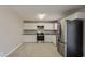 Clean kitchen featuring stainless steel appliances, ample white cabinetry, and neutral countertops at 810 N Carter Dr, Jonesboro, GA 30236