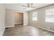 Cozy living room with hardwood floors, neutral paint, and plenty of natural light from two windows at 810 N Carter Dr, Jonesboro, GA 30236