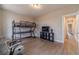 Spacious bedroom with wood-look floors features bunkbed and natural light at 99 Youth Jersey Rd, Covington, GA 30014