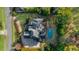 Aerial view of home showcasing backyard pool, deck, and landscaping at 135 Newcastle Ct, Roswell, GA 30076
