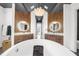 Spacious bathroom showcases dual vanities, a soaking tub, and modern lighting at 135 Newcastle Ct, Roswell, GA 30076