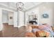 Hallway view of a spacious bedroom with hardwood floors, and vaulted ceilings at 135 Newcastle Ct, Roswell, GA 30076