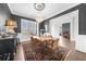 Elegant dining room with chandelier, hardwood floors, and neutral wall color at 135 Newcastle Ct, Roswell, GA 30076