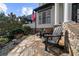 Cozy front porch featuring flagstone patio, outdoor seating, and classic architectural details at 135 Newcastle Ct, Roswell, GA 30076