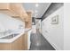 A modern laundry room with built-in sink, white marble countertops, and new washer and dryer at 135 Newcastle Ct, Roswell, GA 30076