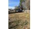A sprawling backyard featuring a well-maintained wooden fence and ample space for outdoor activities at 232 Rockingham Dr, Loganville, GA 30052