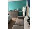 Relaxing bedroom with dresser, mirror, and comfortable seating area at 232 Rockingham Dr, Loganville, GA 30052