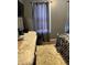 Cozy bedroom with gray walls, fur rug and dark curtains at 232 Rockingham Dr, Loganville, GA 30052