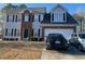 Charming two-story home featuring a brick facade and a well-maintained front yard at 232 Rockingham Dr, Loganville, GA 30052