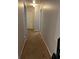 Hallway with neutral walls and carpeted floor at 232 Rockingham Dr, Loganville, GA 30052