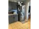 Functional kitchen with stainless steel refrigerator, gray cabinetry, and practical layout at 232 Rockingham Dr, Loganville, GA 30052