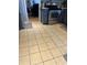 The kitchen features modern stainless steel appliances and neutral tile flooring at 232 Rockingham Dr, Loganville, GA 30052