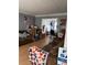 Inviting living room featuring cozy sofas, with an open doorway to another room at 232 Rockingham Dr, Loganville, GA 30052