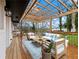 Relaxing covered deck with comfortable outdoor seating, perfect for enjoying the backyard at 2308 Mark Trl, Decatur, GA 30032