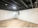 Large unfinished basement featuring painted joists, white walls, and updated flooring at 2308 Mark Trl, Decatur, GA 30032