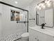 Modern bathroom featuring a glass-enclosed shower and updated vanity with contemporary fixtures at 2308 Mark Trl, Decatur, GA 30032
