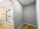 Bright and minimalist bathroom with new glass shower, neutral wall color, and updated flooring at 2308 Mark Trl, Decatur, GA 30032