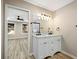Bright bathroom featuring a double sink, white cabinets, and attractive vanity lighting at 2308 Mark Trl, Decatur, GA 30032