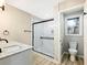Modern bathroom featuring a glass enclosed shower, attractive flooring, and new fixtures at 2308 Mark Trl, Decatur, GA 30032