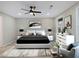 This bedroom features a ceiling fan, bedside tables with lamps, and a sleek, contemporary design at 2308 Mark Trl, Decatur, GA 30032
