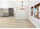 Well-lit dining room features hardwood floors and a modern light fixture at 2308 Mark Trl, Decatur, GA 30032