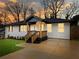 Charming home featuring a brick facade, covered entry, and well-manicured lawn at 2308 Mark Trl, Decatur, GA 30032