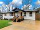 Charming front porch with updated exterior including wood accents and meticulous landscaping at 2308 Mark Trl, Decatur, GA 30032