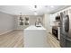 Modern kitchen featuring quartz countertops, island with black faucet, and stainless steel appliances at 2308 Mark Trl, Decatur, GA 30032