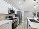 Modern kitchen featuring quartz countertops, stainless steel appliances, and modern fixtures at 2308 Mark Trl, Decatur, GA 30032