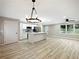 Open concept living space with a large kitchen island and stainless steel appliances at 2308 Mark Trl, Decatur, GA 30032
