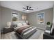 Serene main bedroom with a plush bed, soft lighting, and picturesque window views at 2308 Mark Trl, Decatur, GA 30032