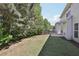 Lush backyard features a well-maintained lawn and shade trees, perfect for outdoor activities at 4416 Water Mill Dr, Buford, GA 30519