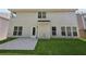 A home backyard features a lawn and back entrance to the home at 4416 Water Mill Dr, Buford, GA 30519