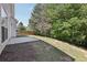 A home backyard features a lawn and back entrance to the home at 4416 Water Mill Dr, Buford, GA 30519