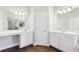 Primary bathroom features dual vanities, wood-look floors, and a separate shower at 4416 Water Mill Dr, Buford, GA 30519