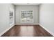 Cozy bedroom offering ample natural light and wood-look flooring, perfect for relaxation and comfort at 4416 Water Mill Dr, Buford, GA 30519