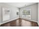 Inviting bedroom featuring plenty of natural light and wood-look flooring creating a warm and inviting space at 4416 Water Mill Dr, Buford, GA 30519