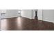 Bedroom with light gray walls, dark wood floors and two windows at 4416 Water Mill Dr, Buford, GA 30519