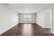 Bedroom with hardwood floors, window, and neutral paint at 4416 Water Mill Dr, Buford, GA 30519