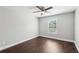 A bright bedroom features wood flooring, neutral walls, window, and white trim at 4416 Water Mill Dr, Buford, GA 30519