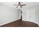 A bright bedroom features wood flooring, neutral walls, and a closet at 4416 Water Mill Dr, Buford, GA 30519
