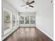 Well-lit bedroom with a ceiling fan and a multiple paned window provides an airy and relaxing atmosphere at 4416 Water Mill Dr, Buford, GA 30519